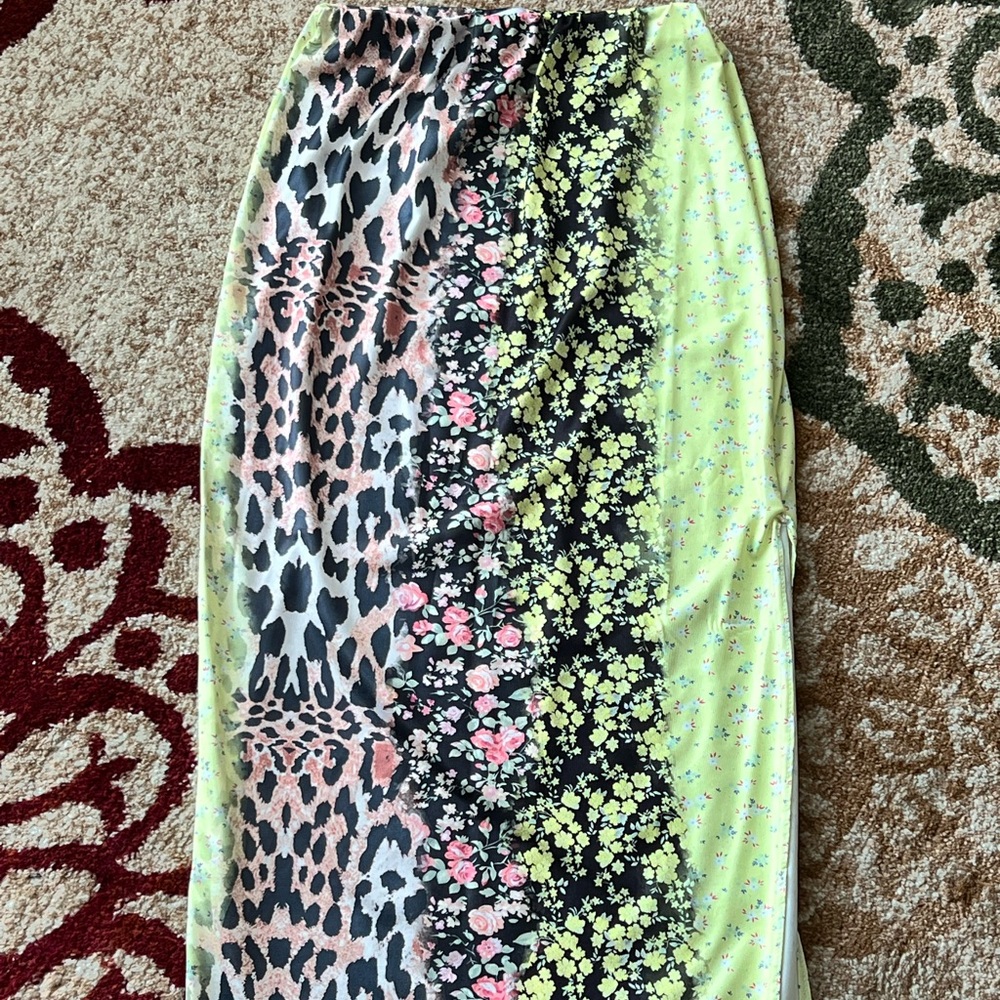 Multi-colored midi skirt. Super cute and abstract with a high side split.